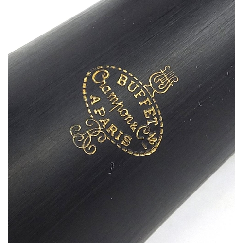 704 - Buffet four piece ebonised clarinet retailed by Crampon & Co, Paris, housed in a fitted box