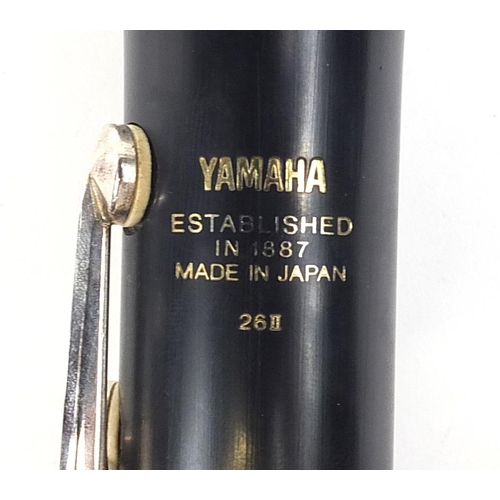 706 - Yamaha ebonised four piece clarinet numbered 26II, housed in a fitted case