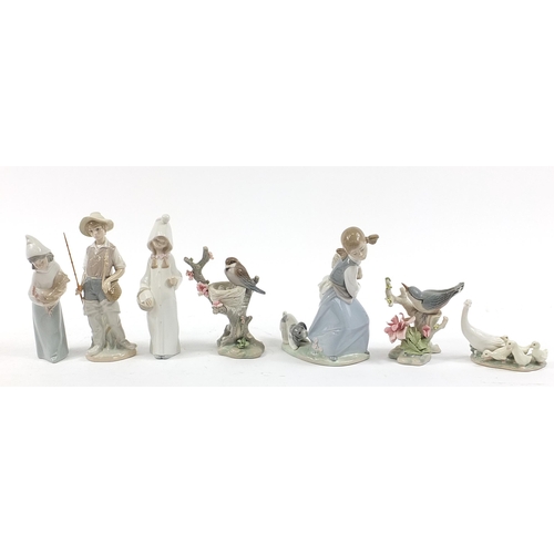 501 - Seven Lladro figure and animal groups including Young Fisherman and Girl with Puppy, the largest 21.... 