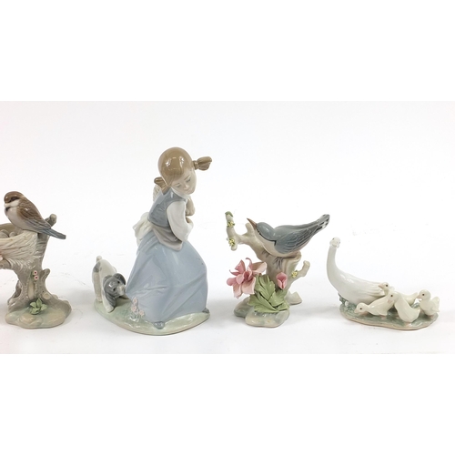 501 - Seven Lladro figure and animal groups including Young Fisherman and Girl with Puppy, the largest 21.... 