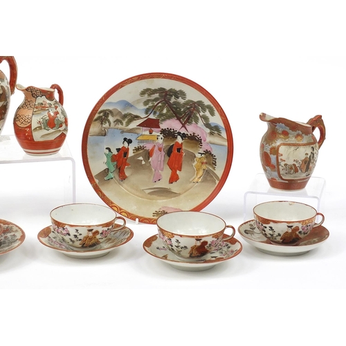 1253 - Japanese Kutani porcelain including a teapot, milk jugs and cups with saucers, the largest 17cm high