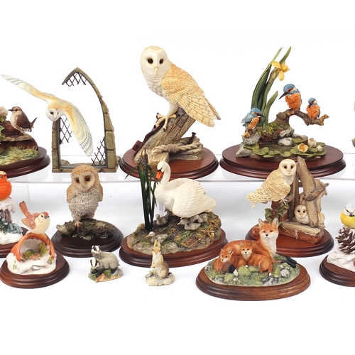 513 - Predominantly Border Fine Arts model animals on stands including birds and a group of foxes titled F... 