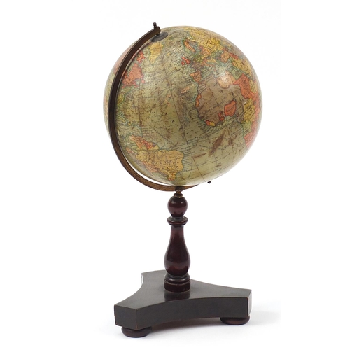 181 - Geographia 10 inch terrestrial table globe raised on a hardwood base with turned column and brass ar... 