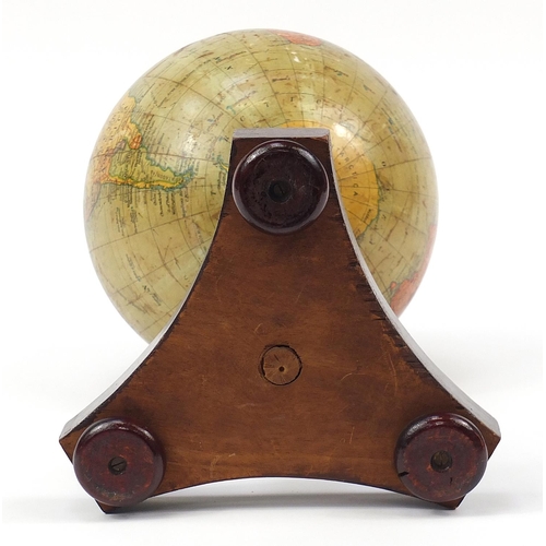 181 - Geographia 10 inch terrestrial table globe raised on a hardwood base with turned column and brass ar... 