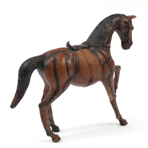 1226 - Large leather covered horse in the style of Liberty, 50cm in length