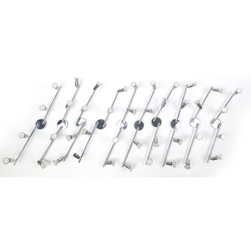 1487 - Nine contemporary adjustable chromed four branch wall lights, each 78cm in length