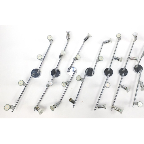 1487 - Nine contemporary adjustable chromed four branch wall lights, each 78cm in length