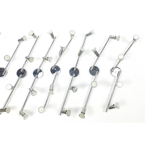 1487 - Nine contemporary adjustable chromed four branch wall lights, each 78cm in length