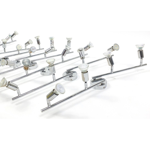 1487 - Nine contemporary adjustable chromed four branch wall lights, each 78cm in length