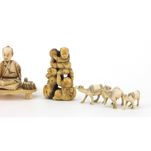 411 - Japanese carved ivory okimono, two netsukes and four carved ivory camels, the largest 6cm wide