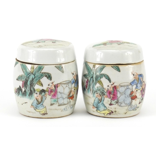 397 - Pair of Chinese porcelain pots and covers hand painted in the famille rose palette with children, ea... 