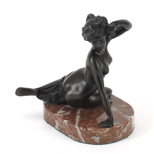 186 - Patinated bronze semi nude figurine raised on a marble base, 14cm high