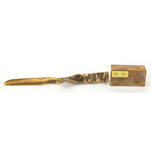 1267 - Modernist bronze letter opener and stamp roller, the letter opener 23.5cm in length