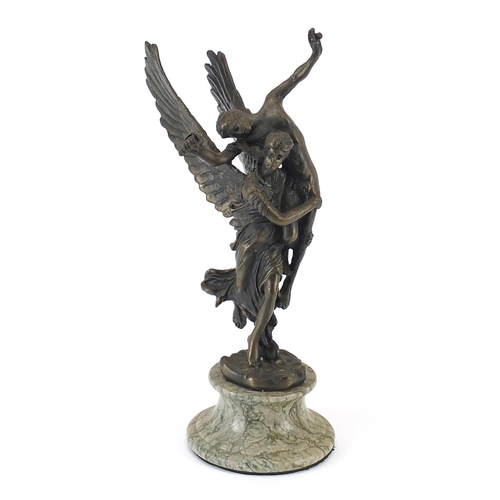 435 - Patinated bronze study of a winged figure carrying a nude figure, raised on a marble base, 29cm high