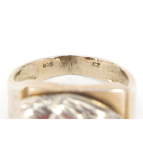 819 - Silver gilt puma's head signet ring set with cubic zirconias, size V, 7.3g