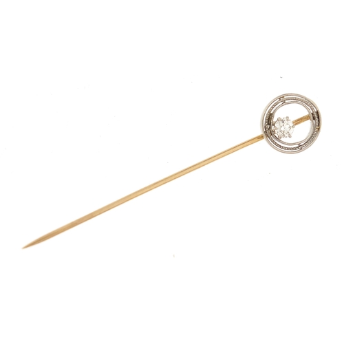 779 - Unmarked gold diamond solitaire stick pin, 6cm in length, 2.3g