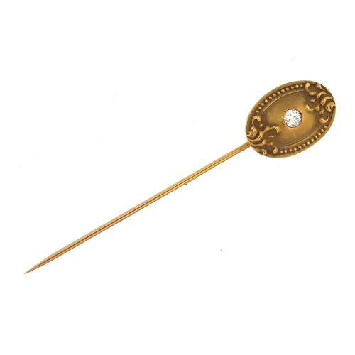 817 - Unmarked gold diamond solitaire stick pin, 7cm high, 2.5g