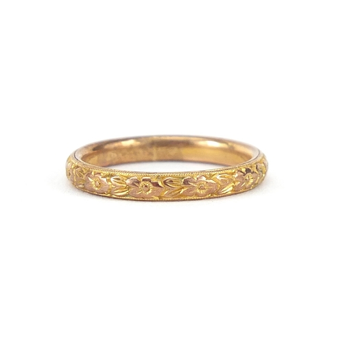 810 - 9ct gold wedding band cast with flower heads, size K/L, 2.2g