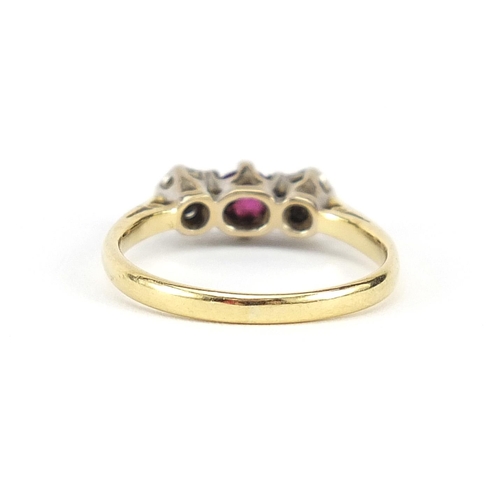 882 - 18ct gold ruby and diamond three stone ring, size N, 3.0g