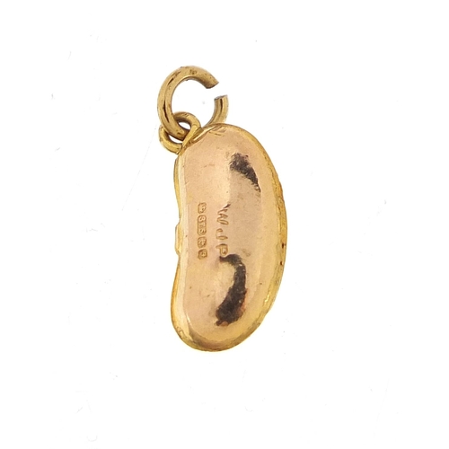 927 - 9ct gold kidney bean charm, 1.5cm high, 0.4g