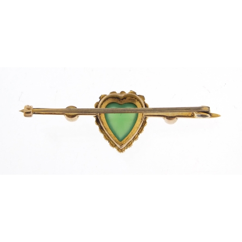 763 - Unmarked gold green stone and seed pearl love heart bar brooch housed in a Searle & Co Ltd London fi... 