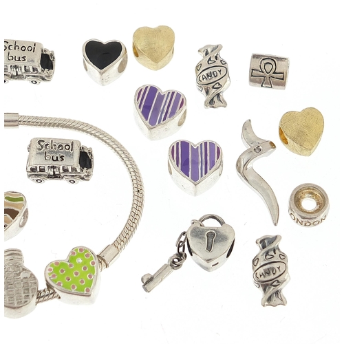 1059 - Pandora design silver charm bracelet with a selection of silver charms, some enamel, the bracelet 21... 