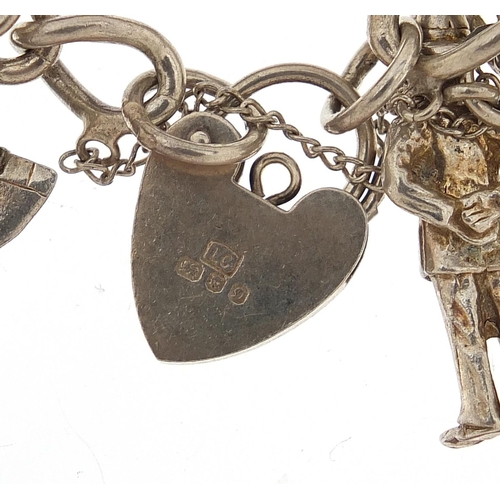 1148 - Silver charm bracelet with a large selection of mostly silver charms including Concorde, 84.8g