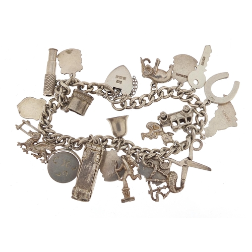 1066 - Silver charm bracelet with a selection of mostly silver charms, 56.8g