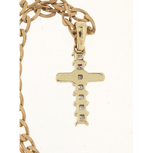 1121 - 9ct gold diamond cross pendant on a 9ct gold necklace, with certificate, approximately 0.25 carat in... 