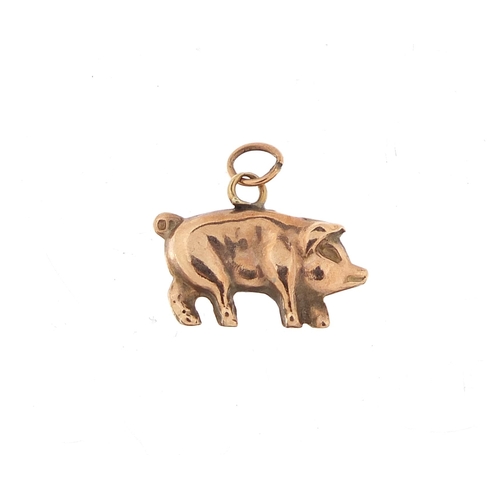 1125 - 9ct gold pig charm, 1.5cm in length, 0.6g