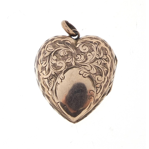 1115 - 9ct gold back and front love heart locket engraved with flowers, 2.8cm high, 4.0g