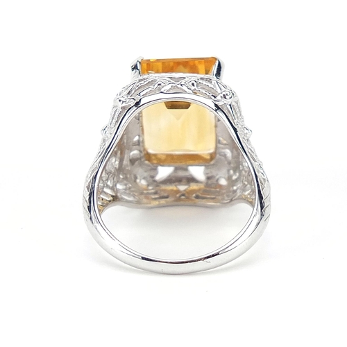 860 - 9ct white gold citrine ring with ornate pierced setting, size N, 7.0g