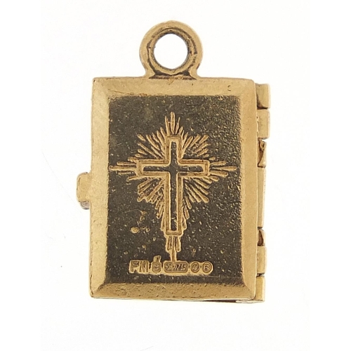 1180 - 9ct gold opening bible charm, 1.2cm high, 3.6g