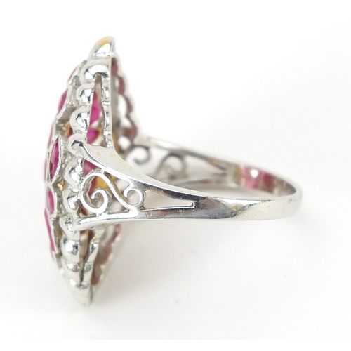 1169 - 18ct gold ruby cocktail ring, size J, 4.0g