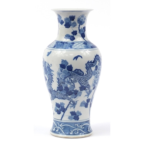 1251 - Large Chinese blue and white porcelain baluster vase hand painted with two dragons amongst flowers, ... 