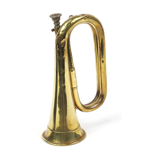 702 - McQueens of Manchester military interest brass bugle with case, 28cm in length