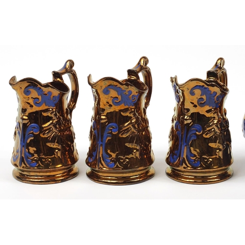 1419 - Five Victorian lustre jugs including one hand painted with flowers, the largest 19.5cm high