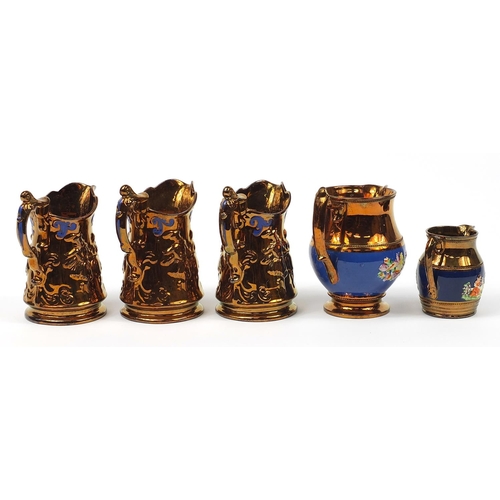 1419 - Five Victorian lustre jugs including one hand painted with flowers, the largest 19.5cm high