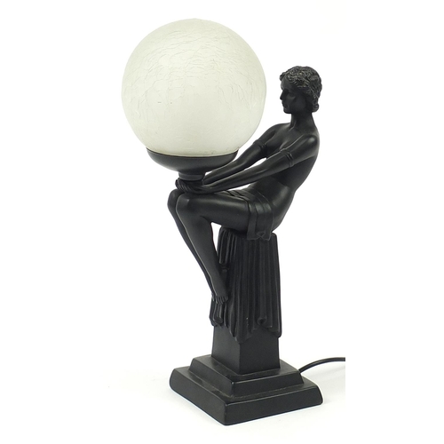 524 - Art Deco design table lamp in the form of a nude female with globular glass shade, 43.5cm high