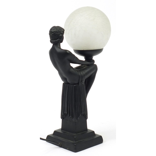 524 - Art Deco design table lamp in the form of a nude female with globular glass shade, 43.5cm high