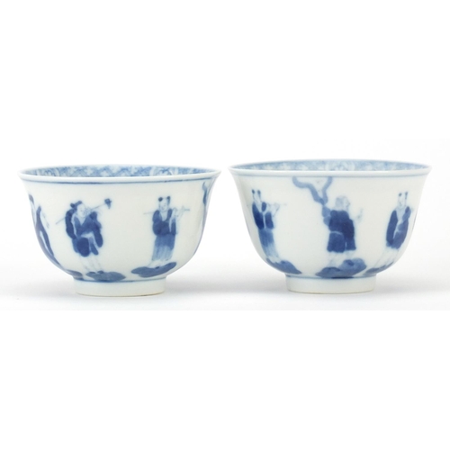 17 - Pair of Chinese blue and white porcelain tea bowls hand painted with figures, four figure character ... 