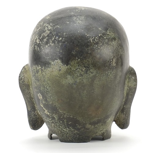 351 - Chino Tibetan archaic style patinated bronze Buddha head, 20cm high