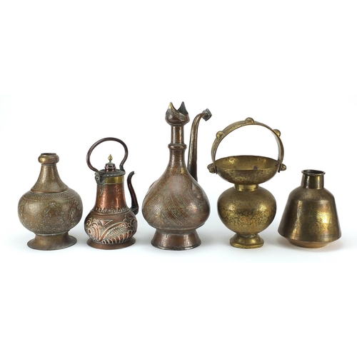 149 - Middle Eastern metalware including coffee pot, spittoon and hookah bases, the largest 36cm high