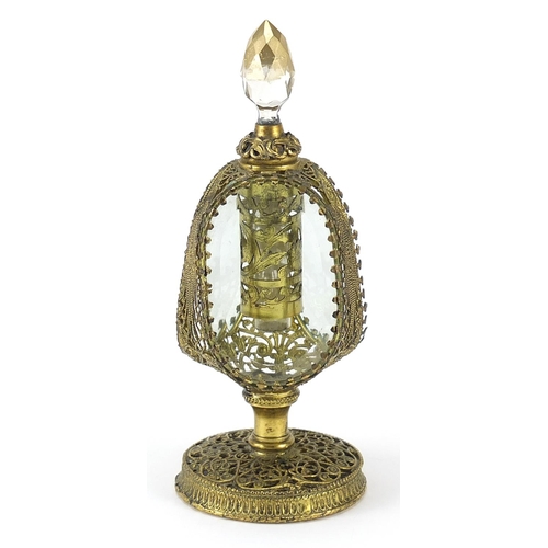 425 - Ornate brass filigree scent bottle with bevelled glass panels, 18.5cm high