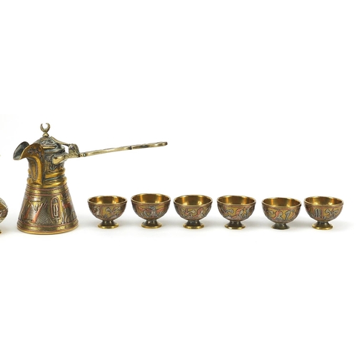 219 - Islamic brass Cairoware with silver inlay comprising coffee pot, six cups on tray and pair of vases,... 