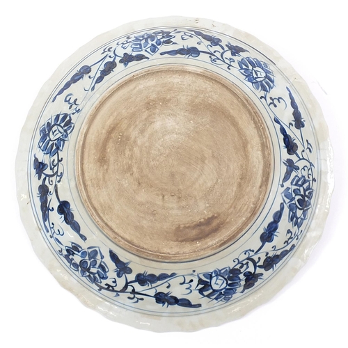 1255 - Large Chinese blue and white porcelain charger hand painted with a dragon, 52cm in diameter