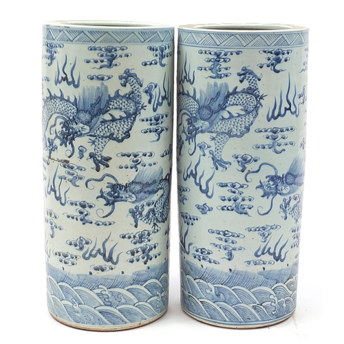 536 - Large pair of Chinese blue and white porcelain vases hand painted with dragons amongst clouds, 61cm ... 