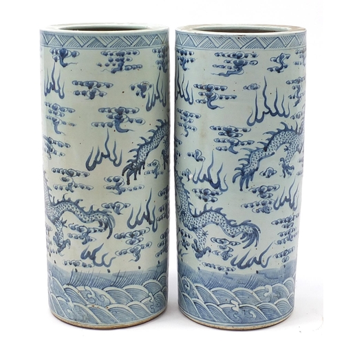 536 - Large pair of Chinese blue and white porcelain vases hand painted with dragons amongst clouds, 61cm ... 