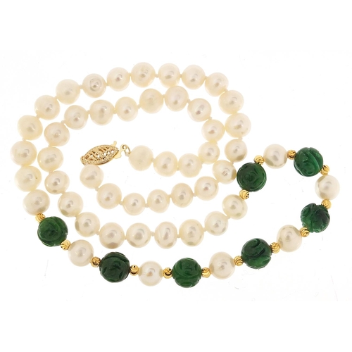 1150 - Single string freshwater pearl and carved green jade  necklace, with 14ct gold clasp, 46cm in length... 