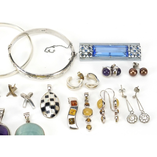 1104 - Silver jewellery set with semi precious stones, some Art Deco design including earrings, pendants, b... 